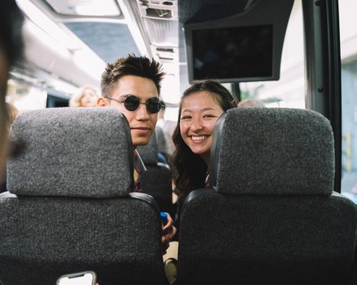 young-couple-traveling-on-a-bus.jpg